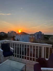 The sunset from the top deck of the house. The tunes from the shaved ice truck occasionally echo through the streets- a sweet ending to a great beach day.