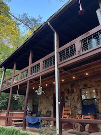 Porch with the hot tub, rocking chairs, and pretty lights
