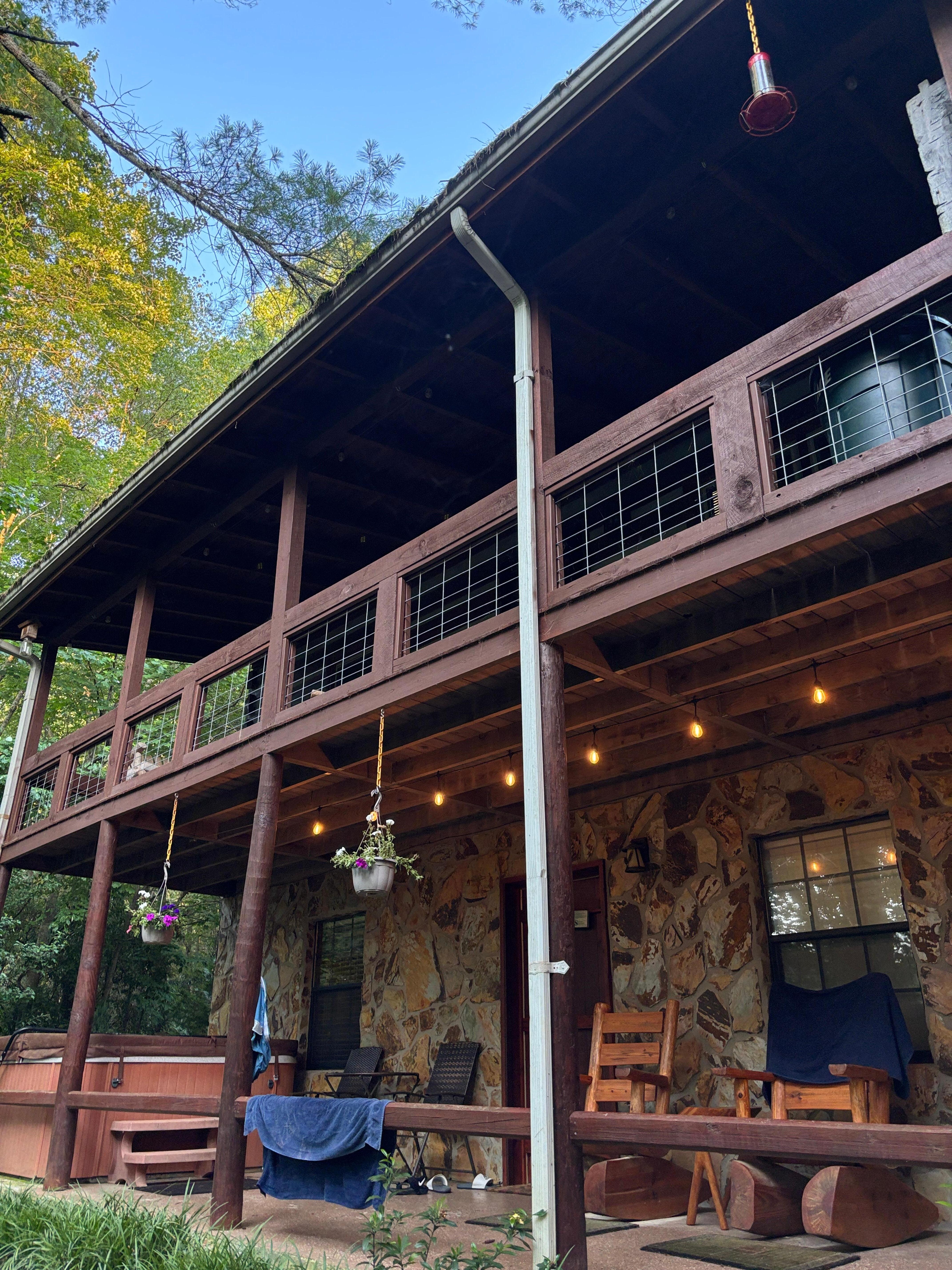 Porch with the hot tub, rocking chairs, and pretty lights