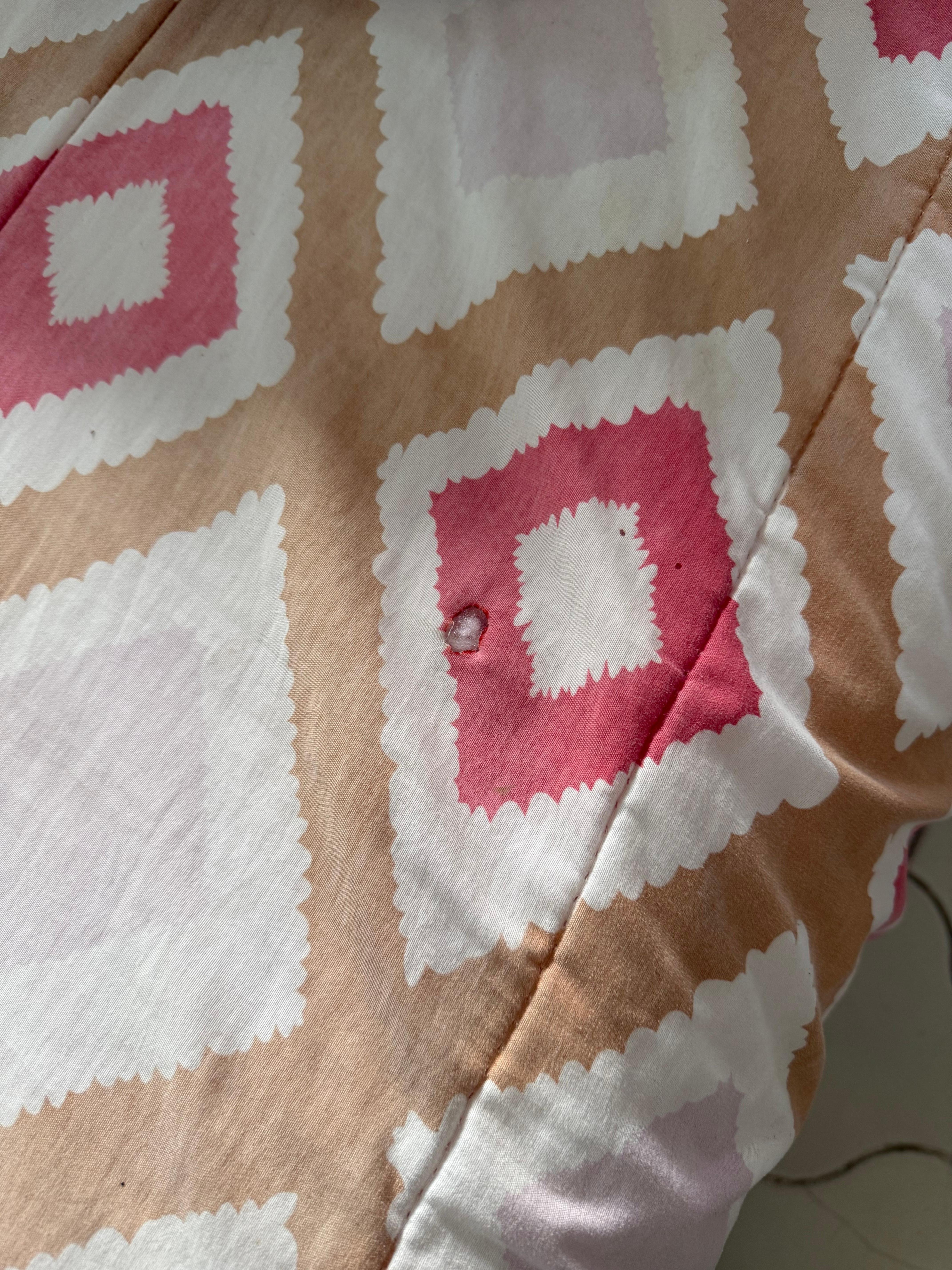 Cigarette burn and small permanent stains. 