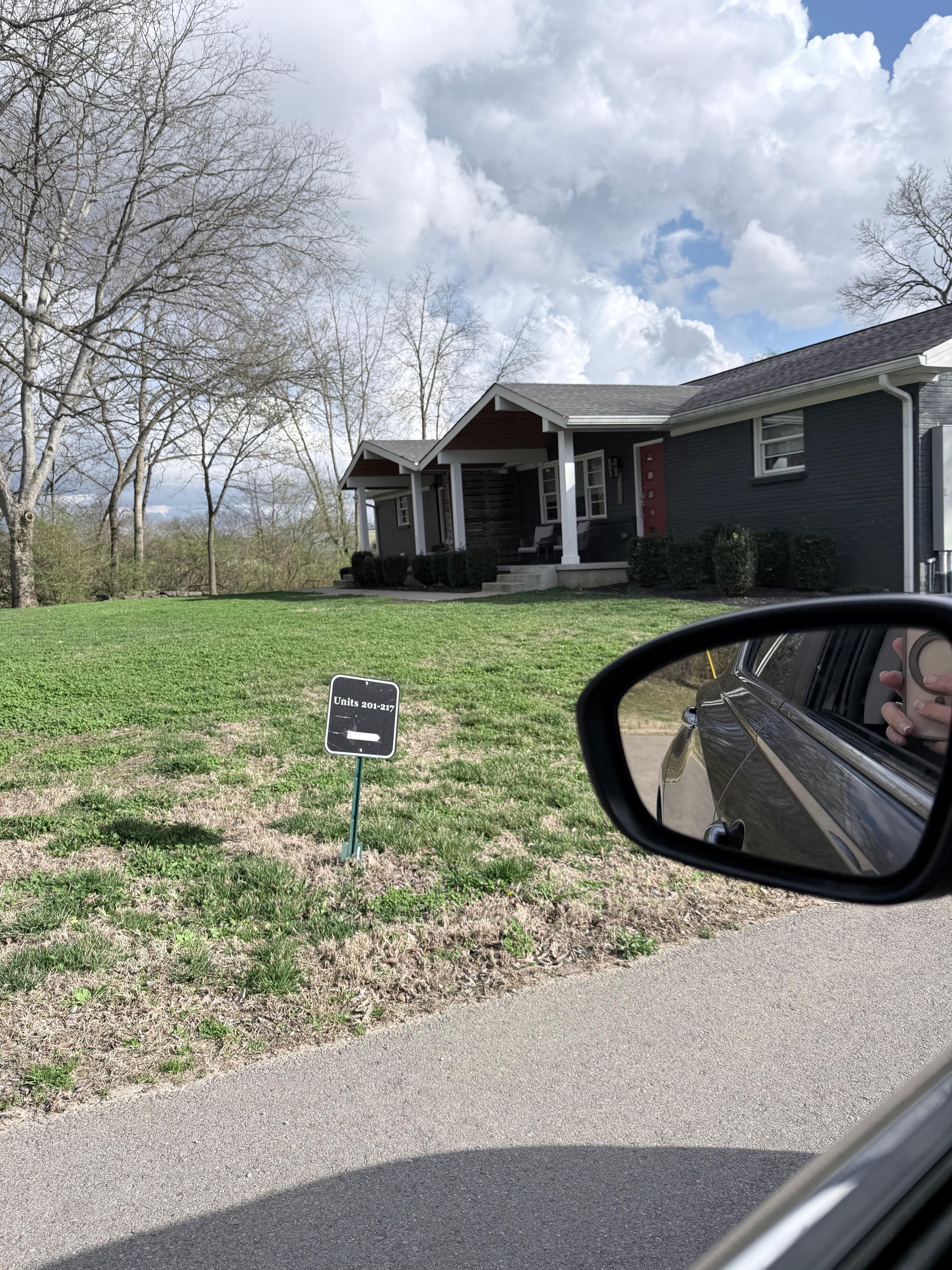 Small yard sign listing units thru 217.  The actual unit is 219.