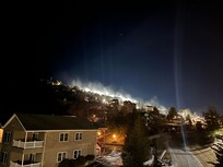 Nighttime view of Beech Mtn with night skiing and snow blowing from the chalet porch