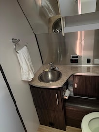 The toilet is also very tight. The shared one is better for most business.