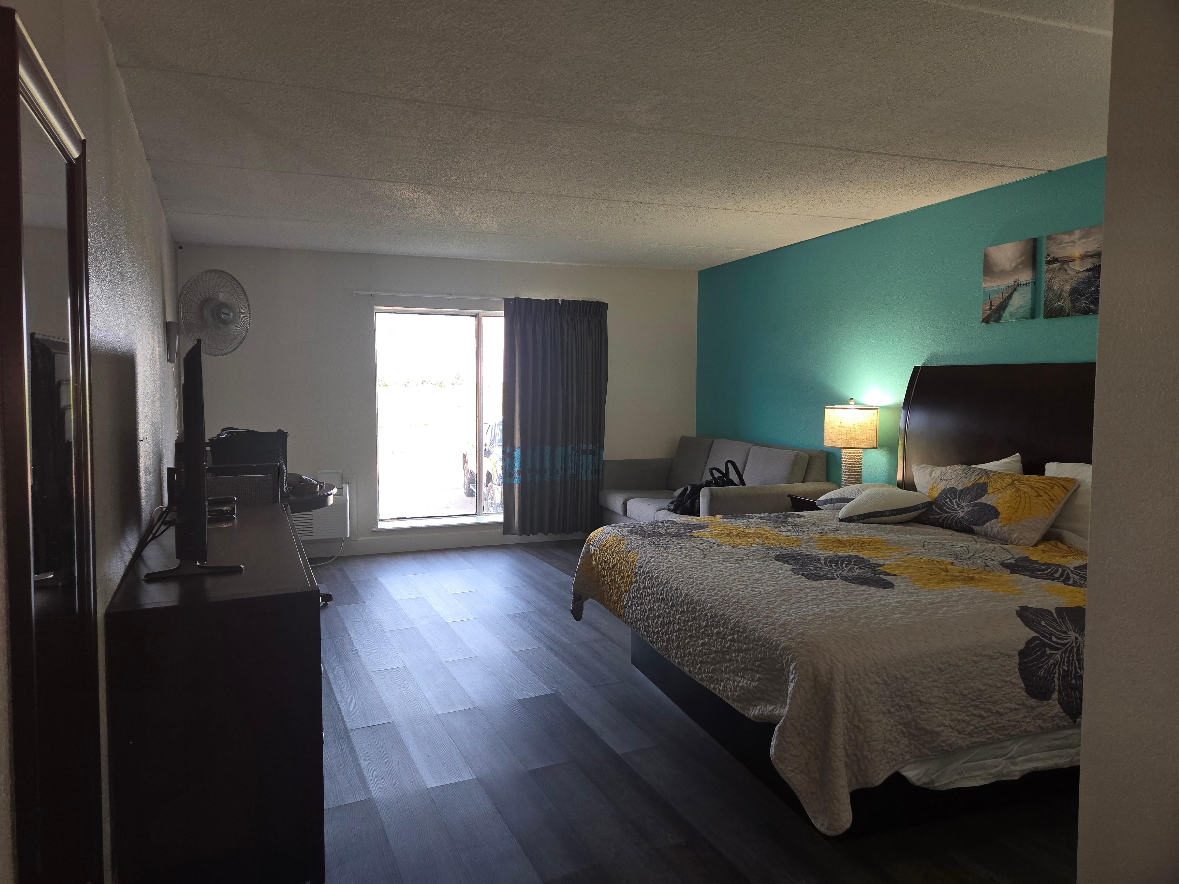 Cute decor.  Appreciate the laminate wood floors.  Big windows with blackout curtains.  No balcony.