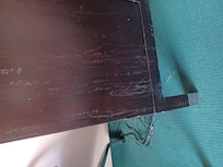 Spilled liquid residue on TV stand