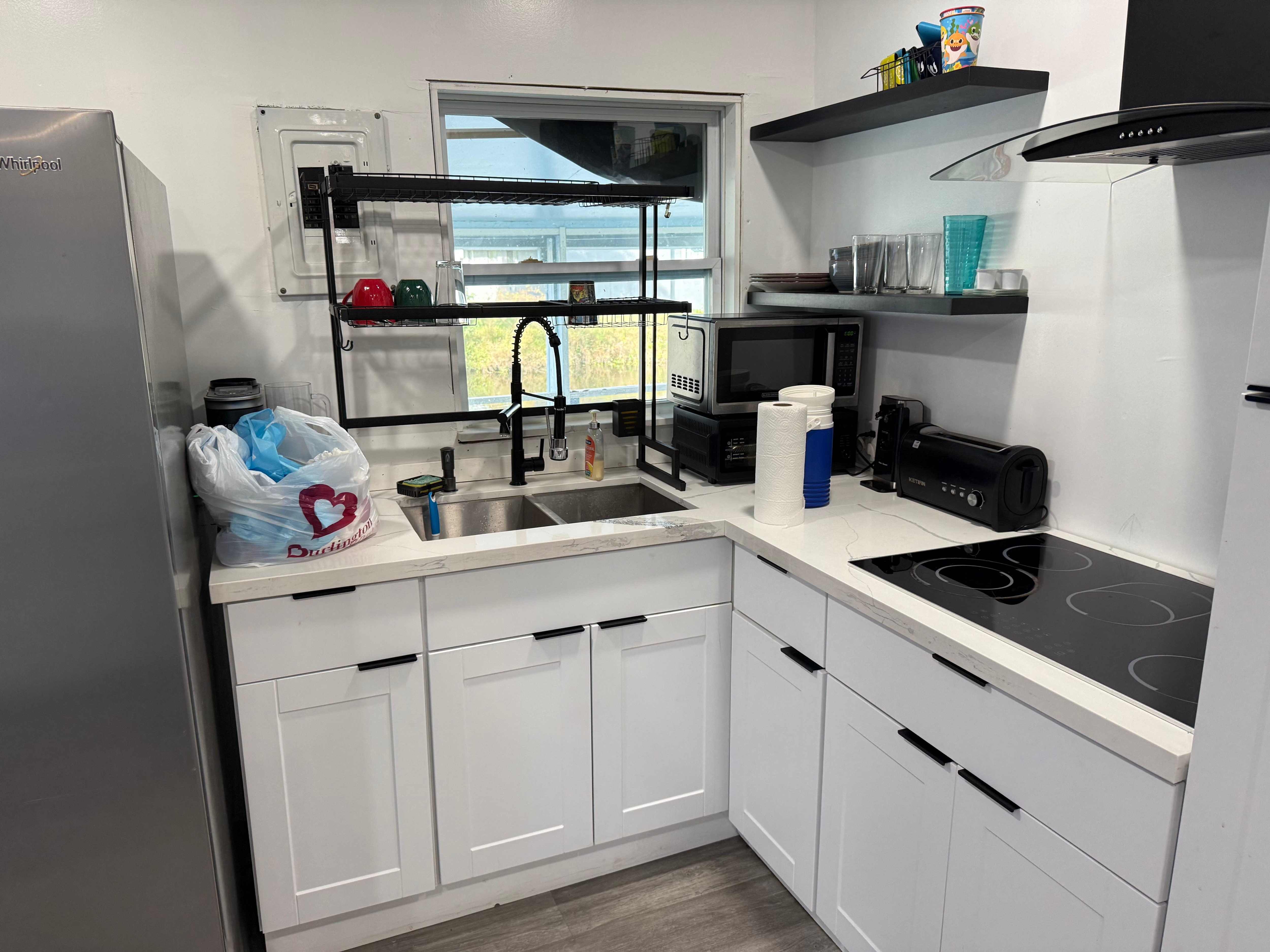 Electric panel
Over sink. Black trash bag as curtain 