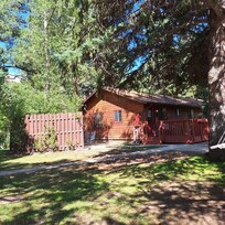 2 bedroom, 1 full bathroom, kitchen, and living room duplex cabin. It has 2 parking spaces.