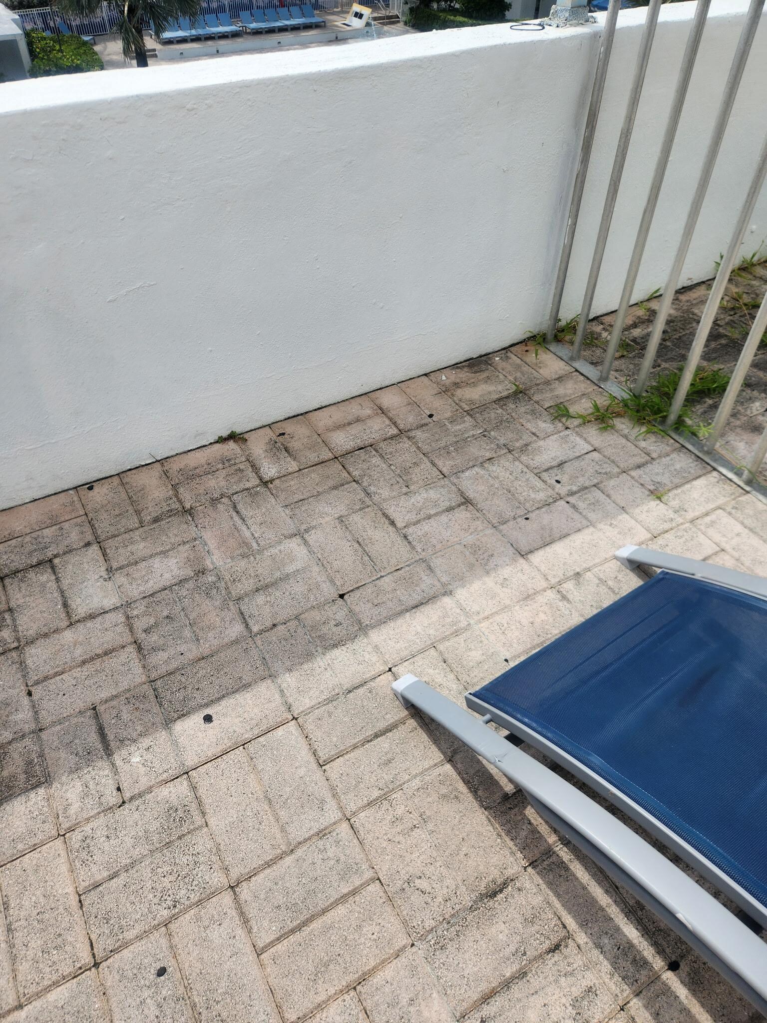 The balcony was not private grass was growing through the concrete