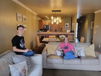 Family relaxing time in the living room, getting ready to play board games!
