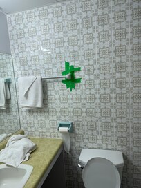 Dick tape to hold a tile in place in the bathroom