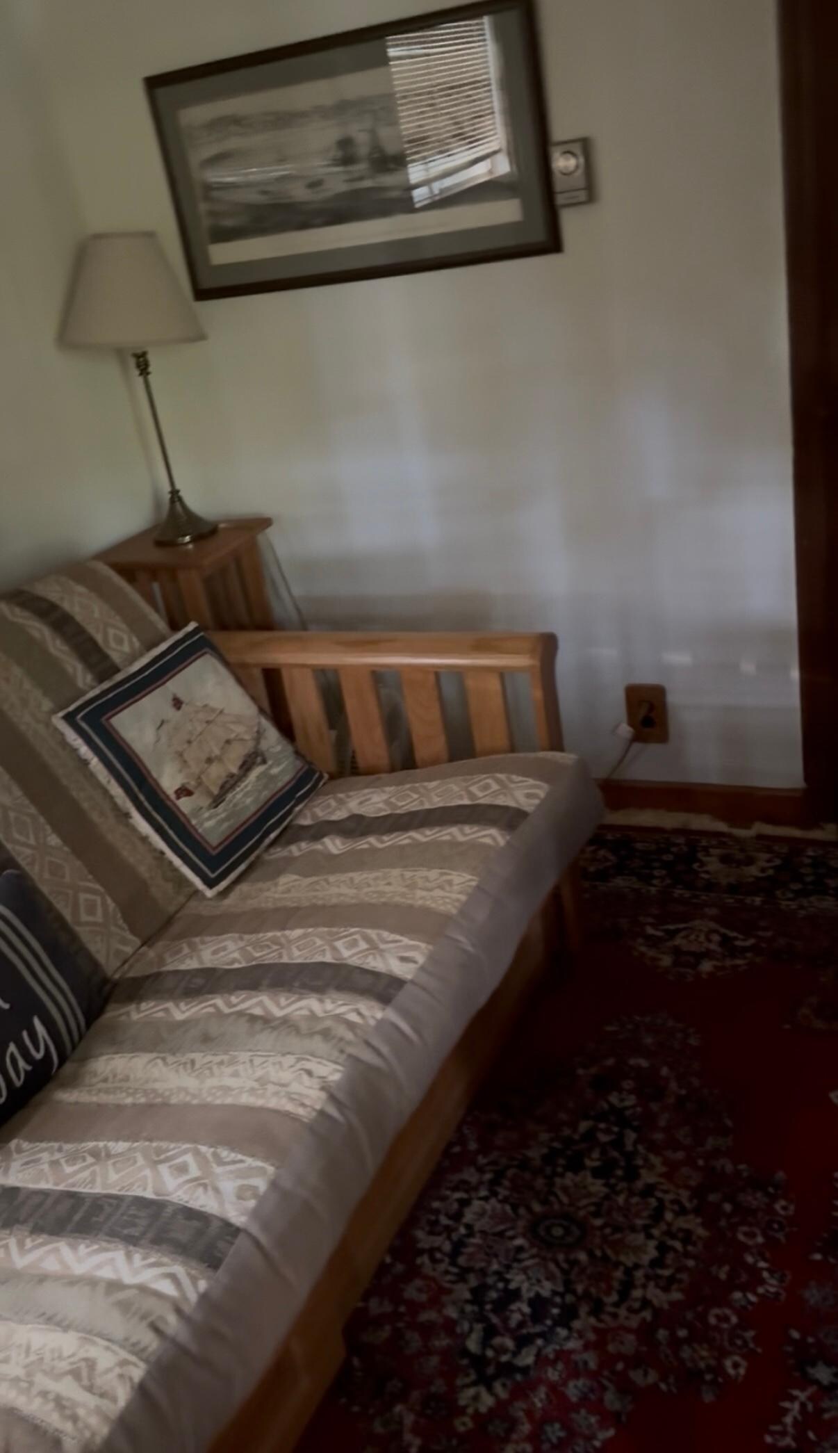 front bedroom with futon and nautical theme