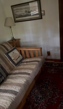 front bedroom with futon and nautical theme