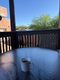 Patio set with view of the mountains and hotel grounds