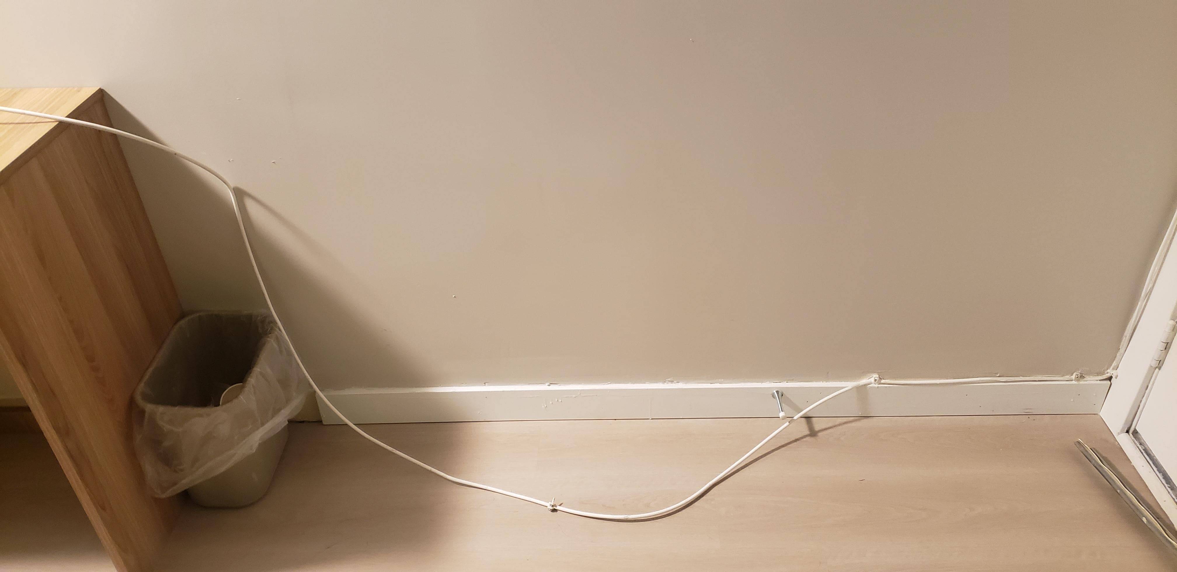 Cable TV coaxial cable pulled out of wall