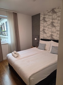 Clean, spacious bedroom.