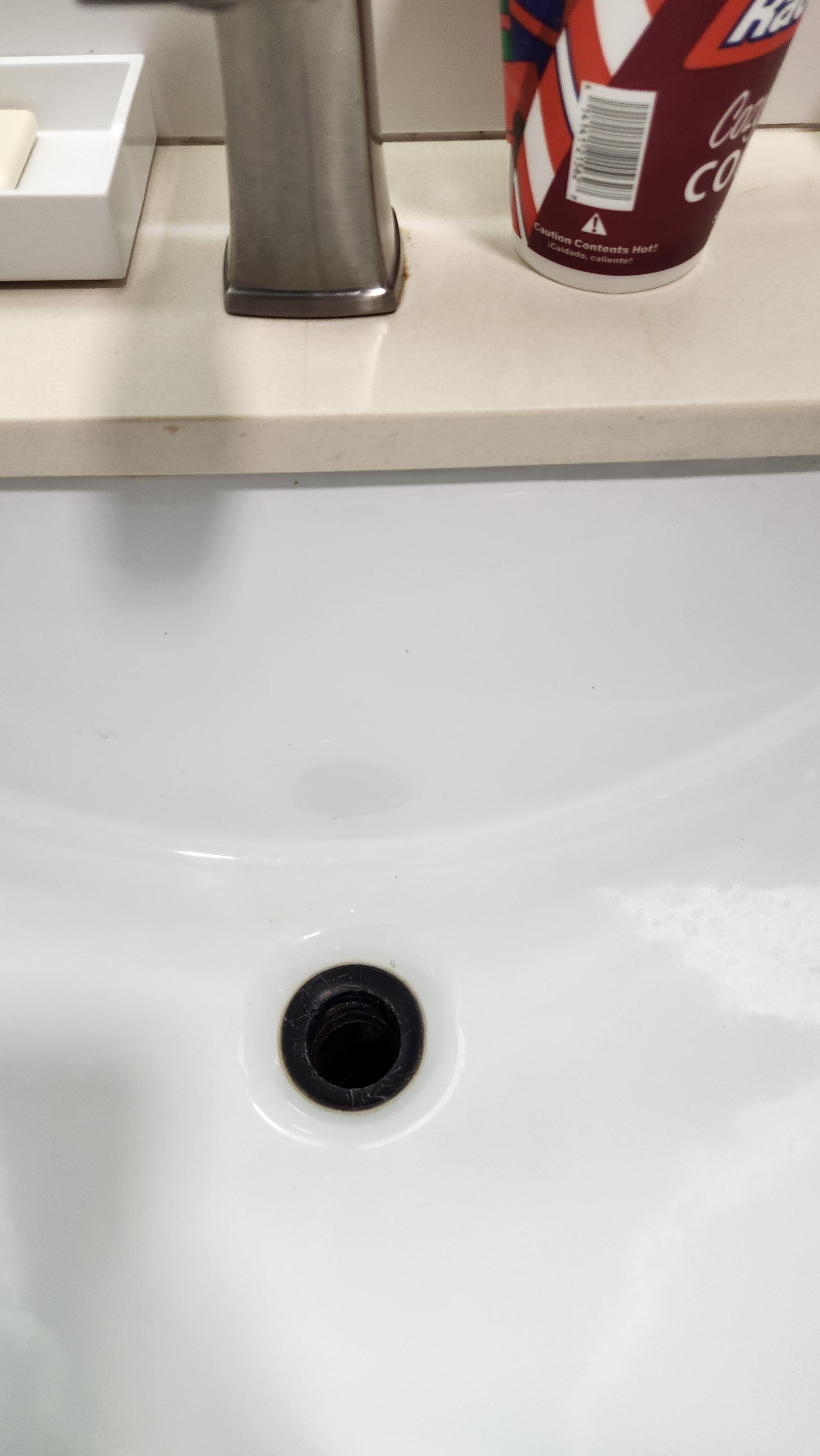 Bathroom sink did not have a stopper or drain screen.