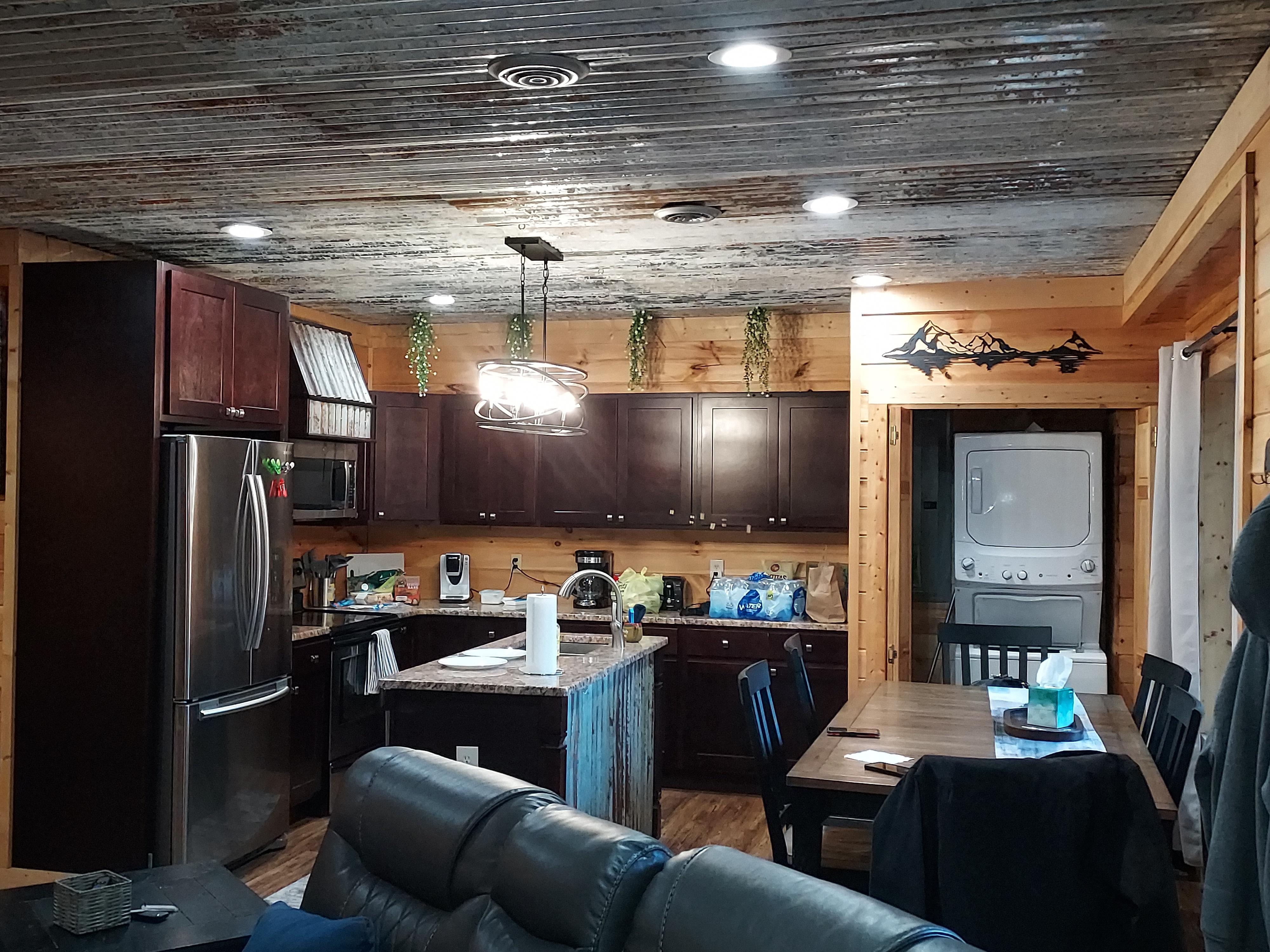 Looking at kitchen.  Plenty of cups, dishes, coffee Kcups to get you started, some spices, ketchup, canola oil, sugar