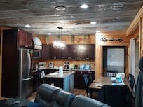 Looking at kitchen. Plenty of cups, dishes, coffee Kcups to get you started, some spices, ketchup, canola oil, sugar