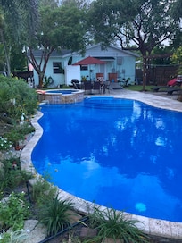 Backyard view of home & pool/spa