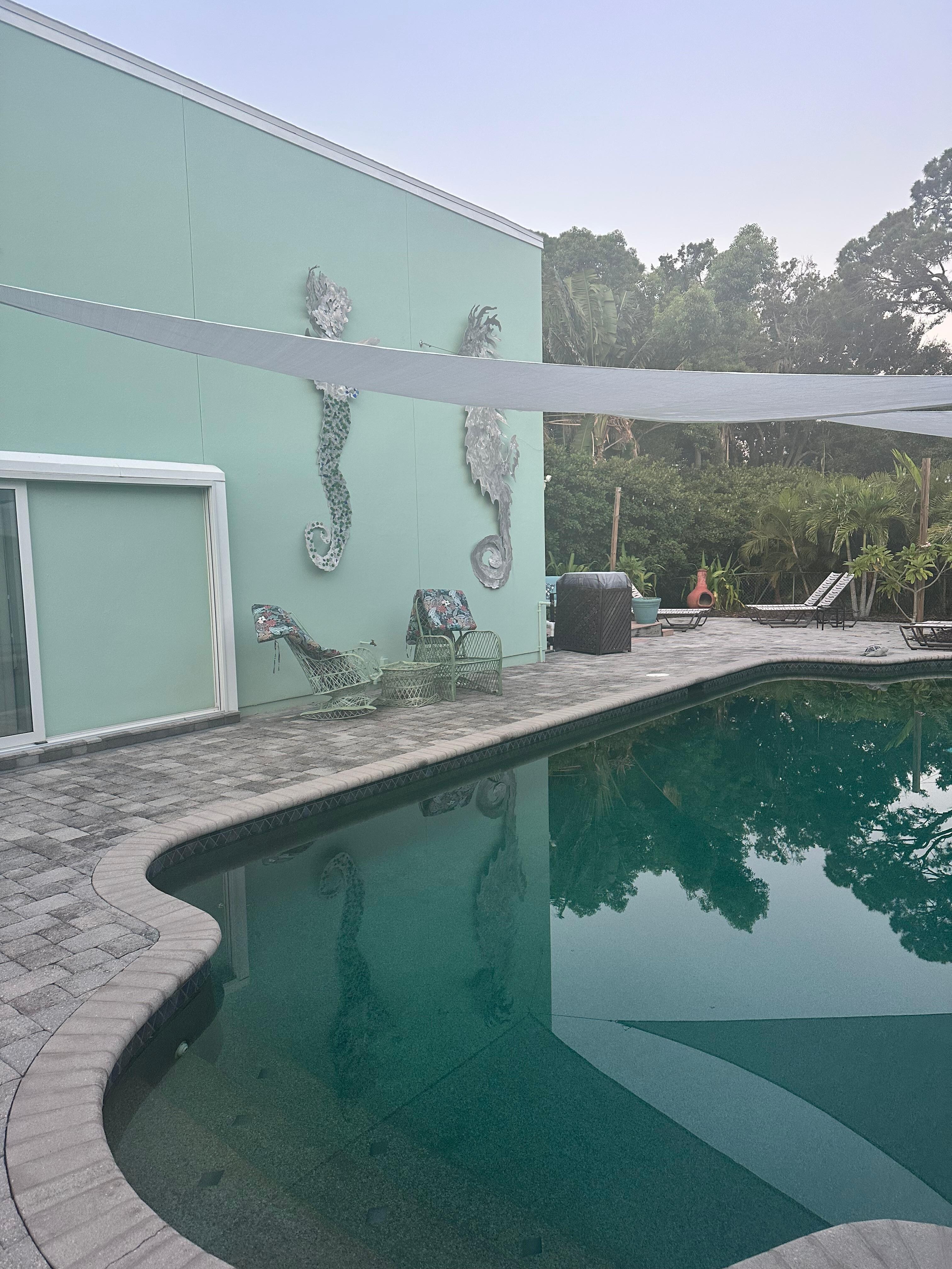 Patio pool area facing west/ The West Wing Entrance.