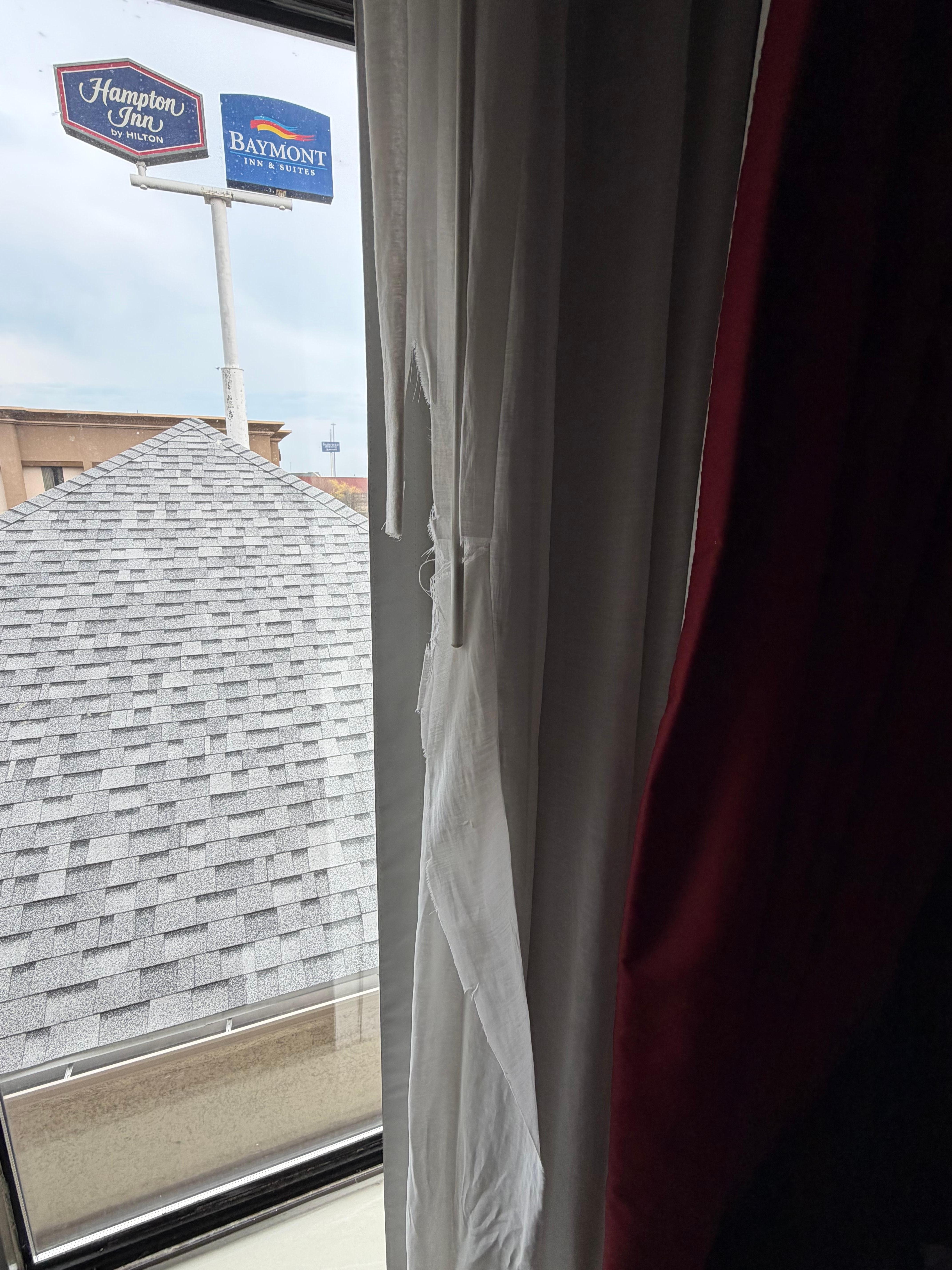 Torn Raggedy curtains