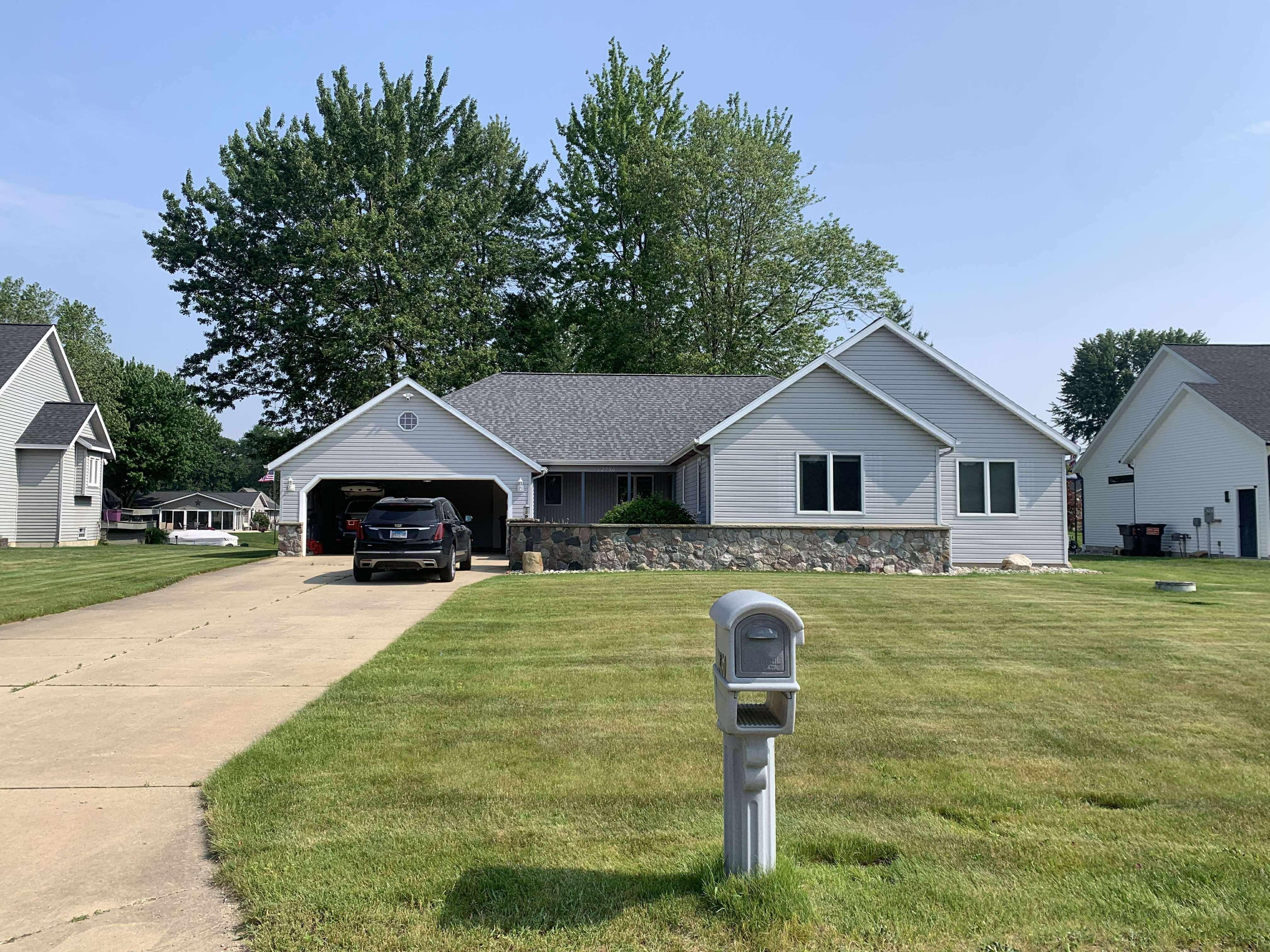 View of home from the driveway. Yes, you can park in their garage. 