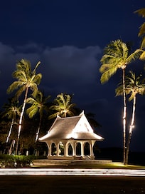Night view into the garden & sea behind