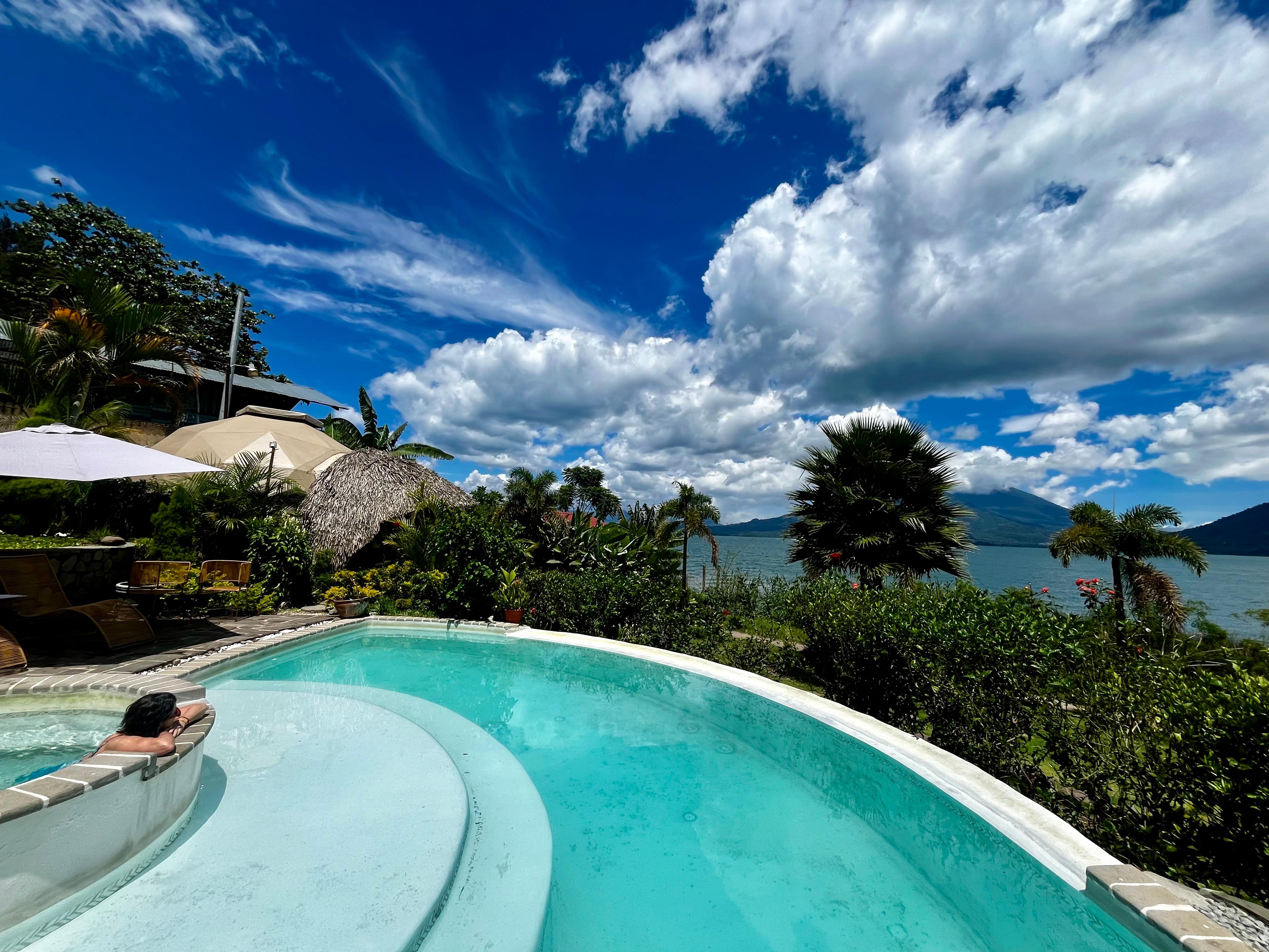 Enjoying the pool and Jacuzzi while looking out onto the lake 