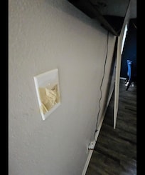 Taped up light switch at the entrance
