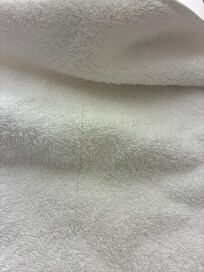 Folding towels had hair on it