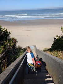 Lugging beach toys down the 3 flights of stairs to the beach
