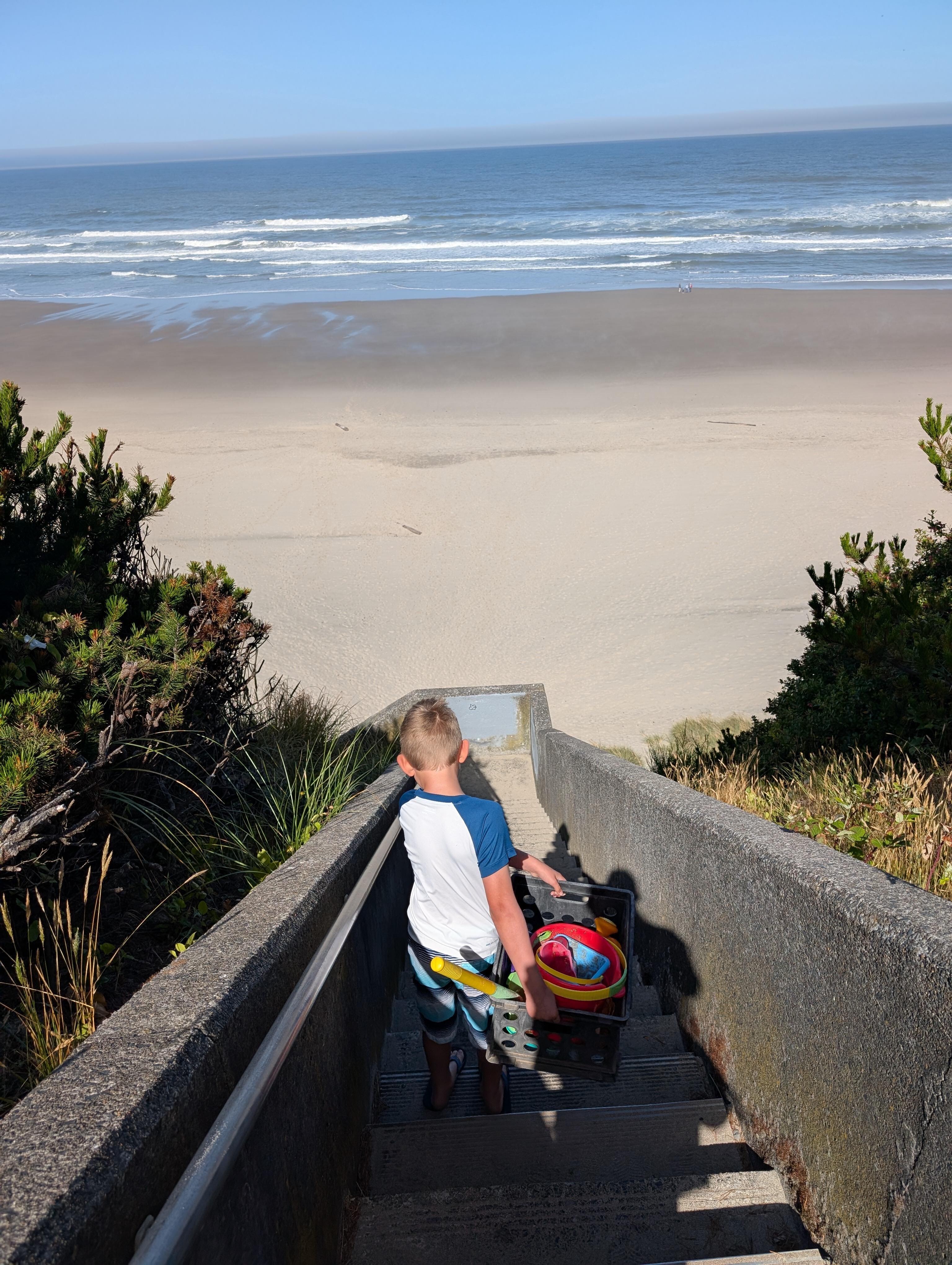 Lugging beach toys down the 3 flights of stairs to the beach