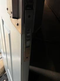 metal doorjam hanging off, door not secure
