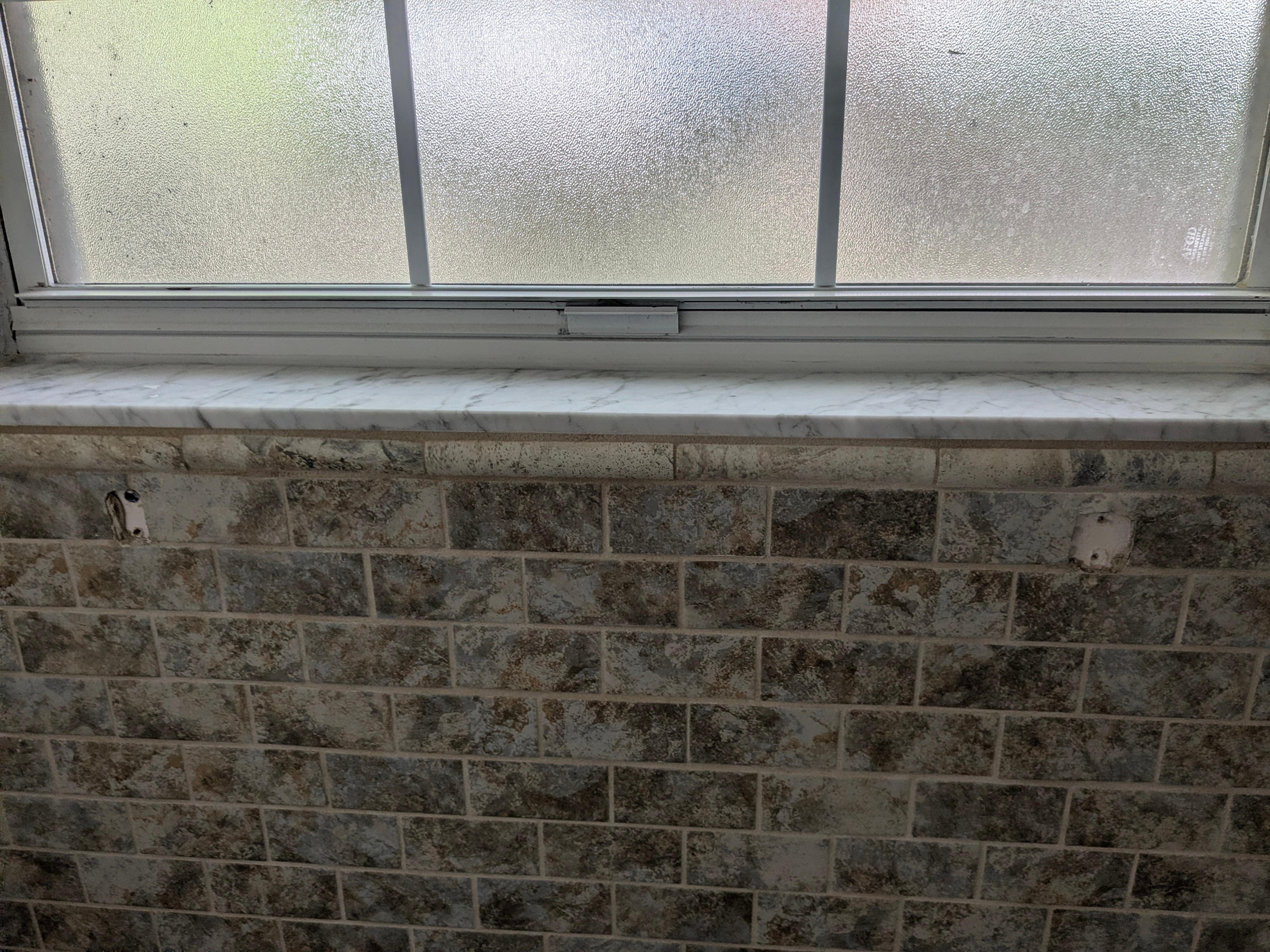 This was in the master bathroom. Looks like a towel rack was here at one time.