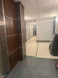 Right in front of elevator