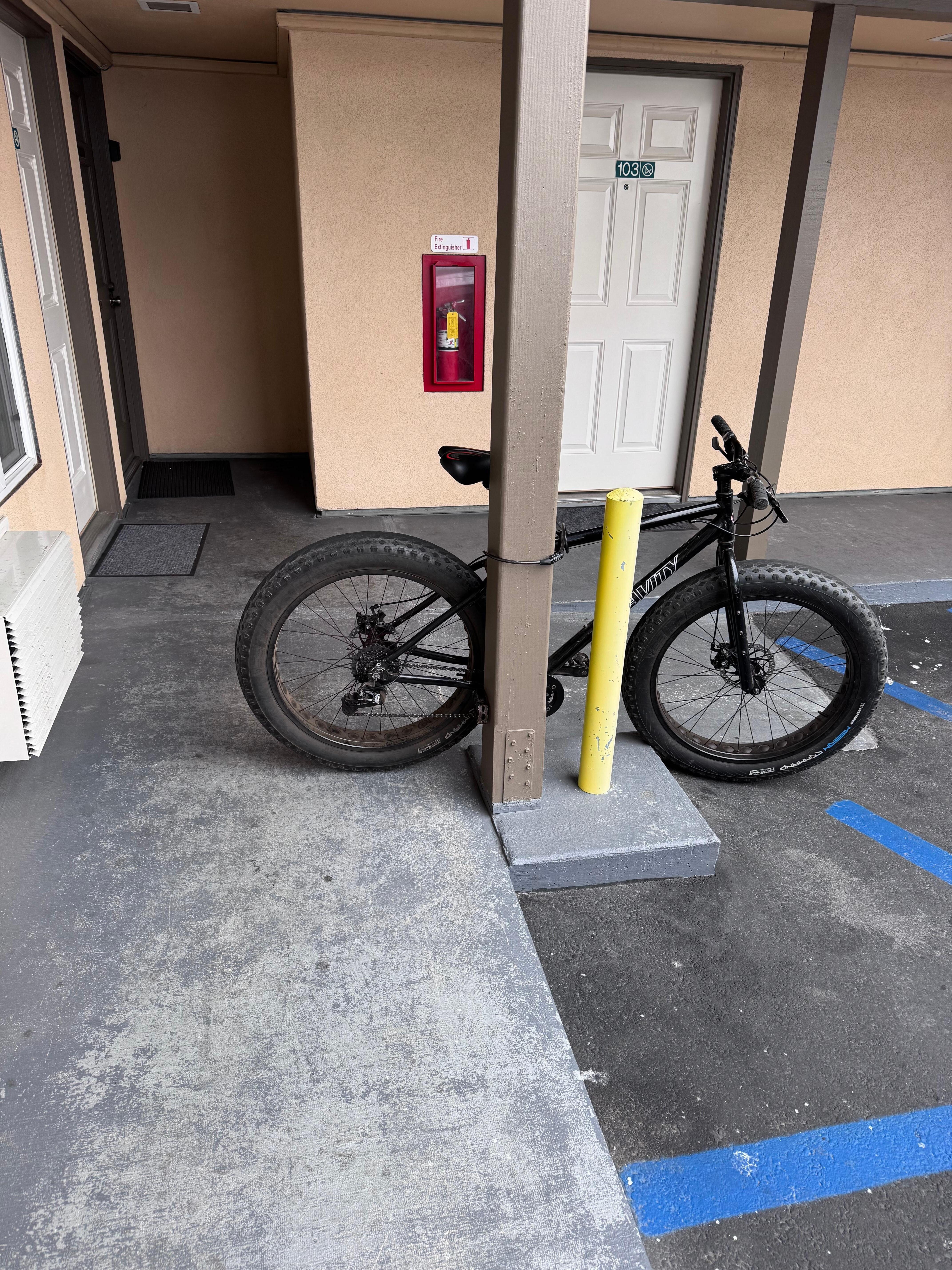 This bike was between my room door and is taking up the entire wheelchair ramp and only leaves a foot to get past and was chained there