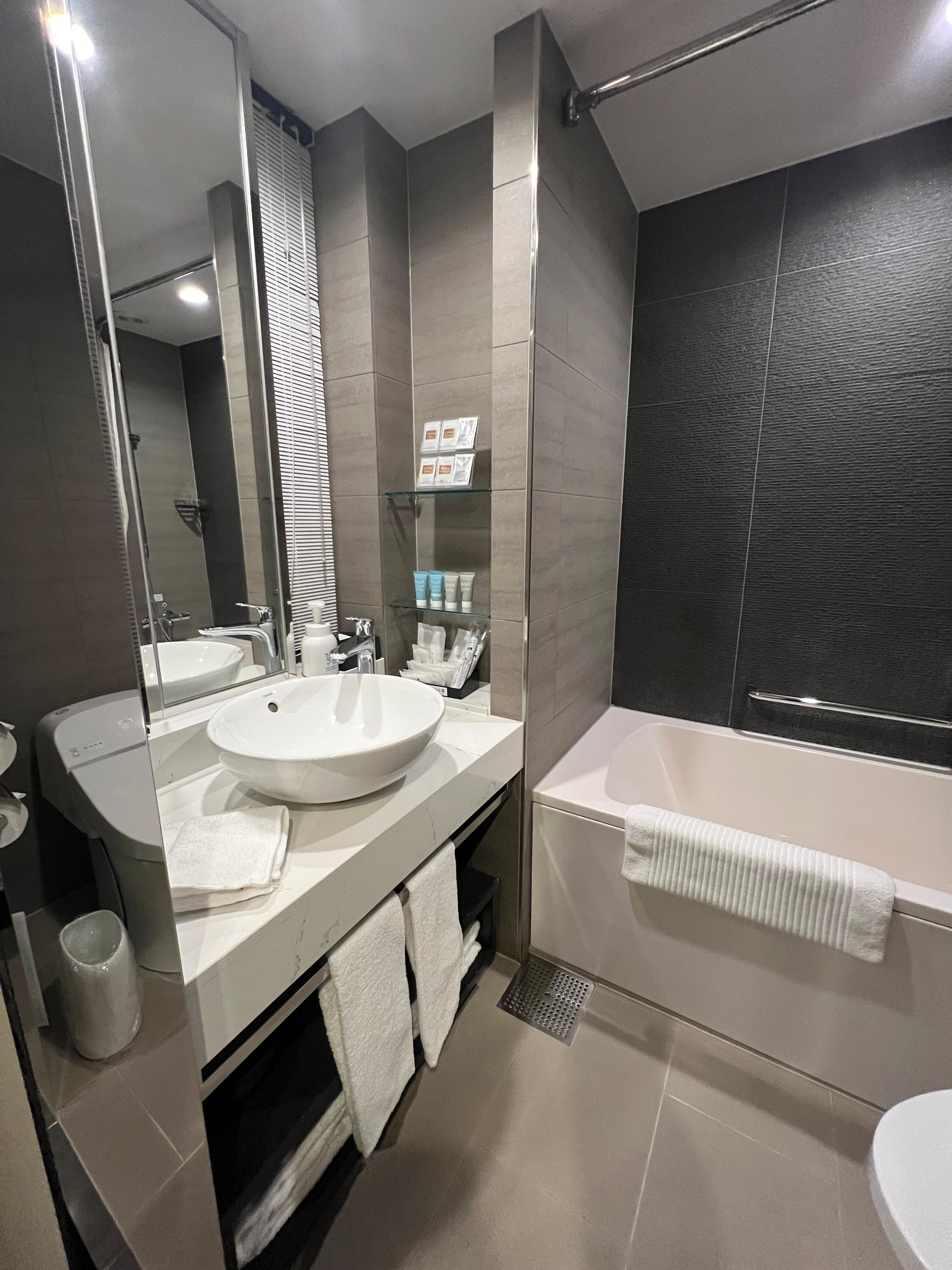 Behind the mirror are blinds that opens into the sleeping area. Both the blinds and the main window curtain needs to be open to let sufficient light into the bathroom.