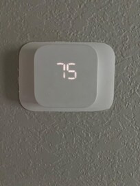 AC trying to cool house down during day but not go below 75 degrees.