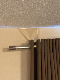 Shower curtain rod for curtains with peeling wall paper hanging