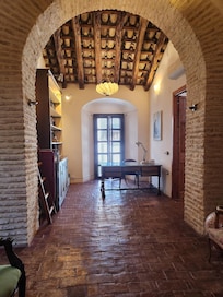 This is the upstairs hall, from which you can access the roof terrace.Check out the details of the ceiling beams.