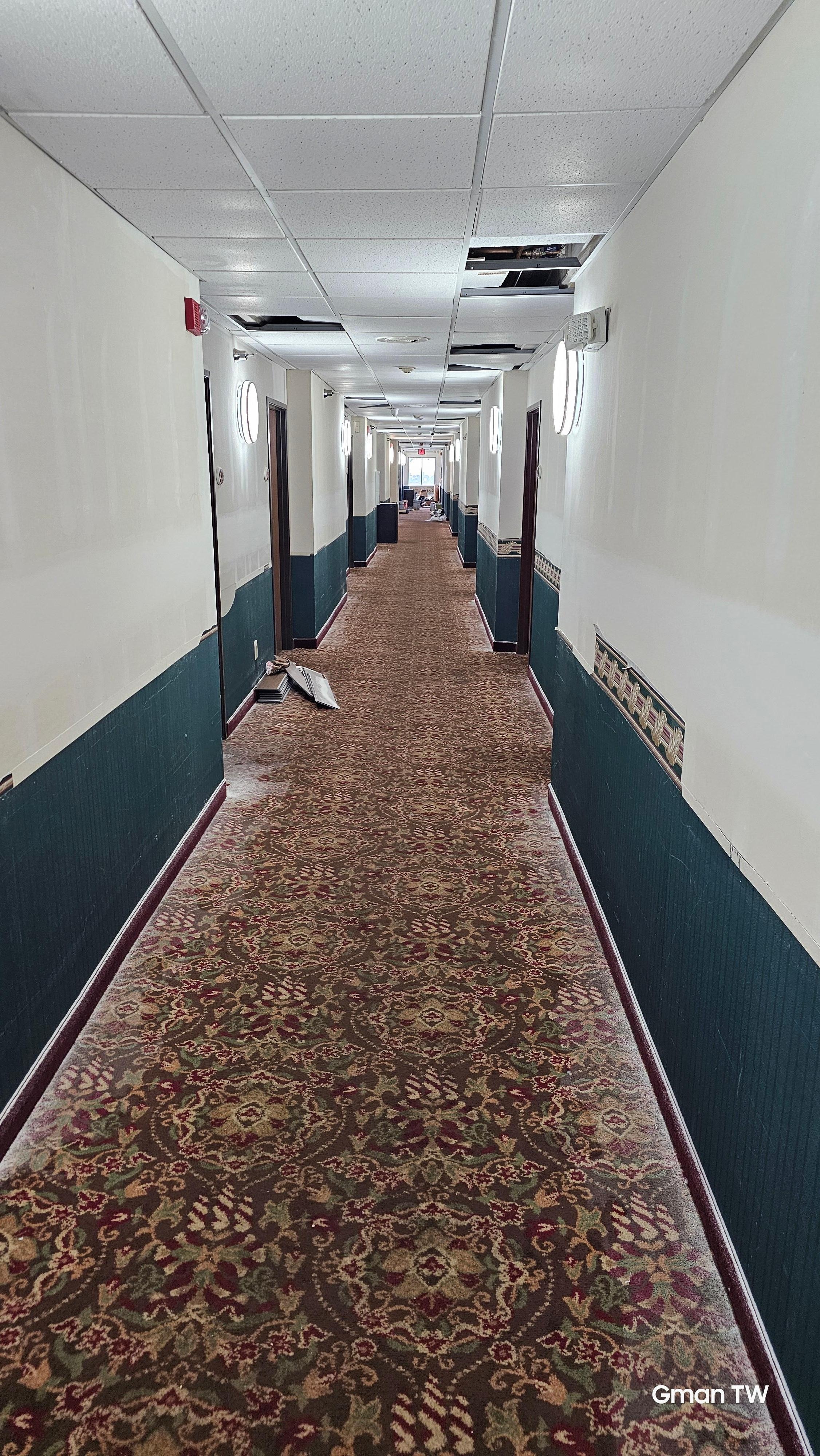 Walking to the room from the elevator. 