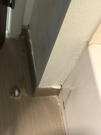 Filthy bathroom floor corner