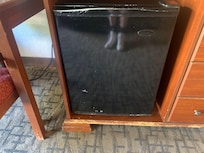 Really shabby battered fridge