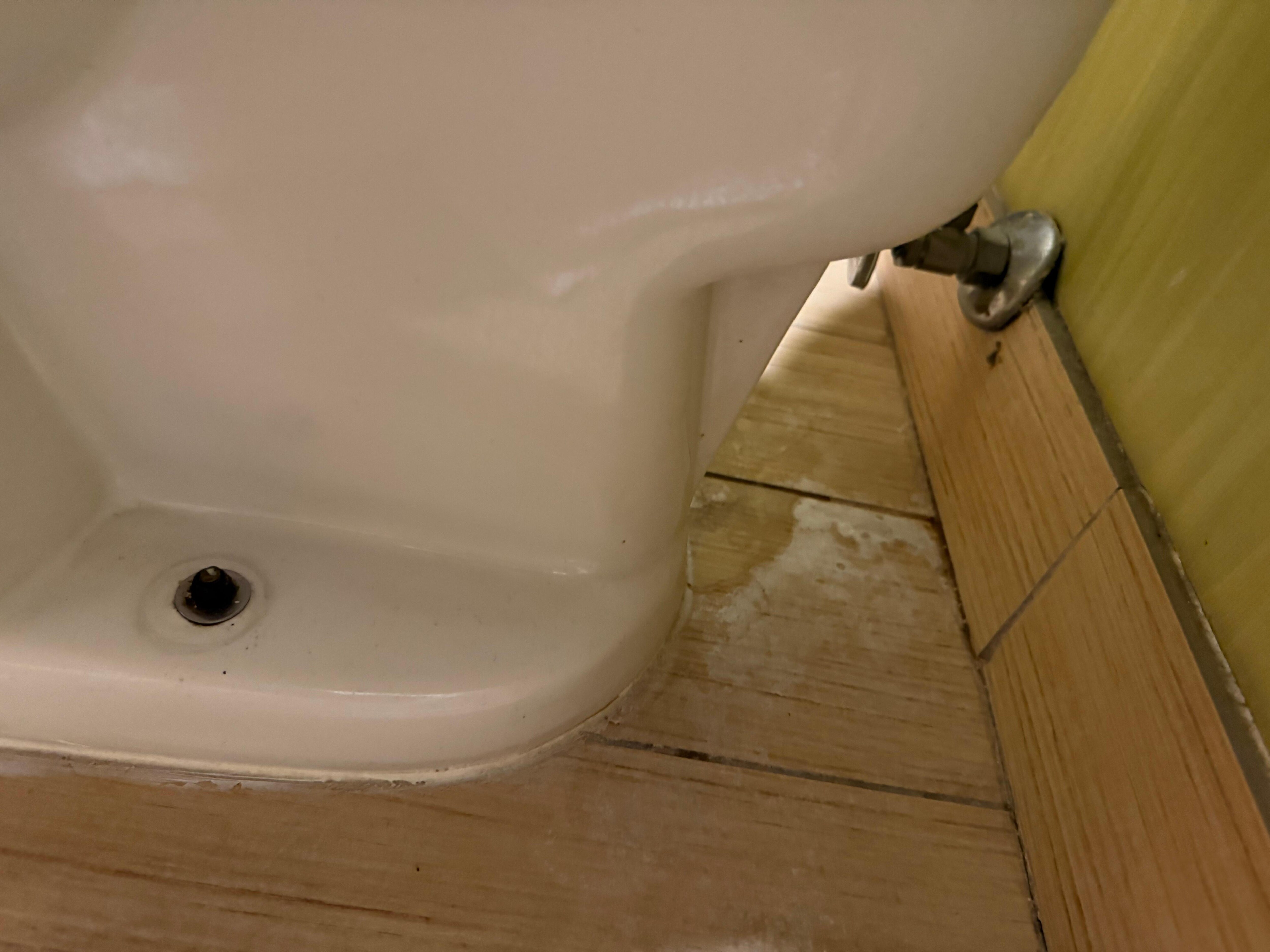 Behind the toilet