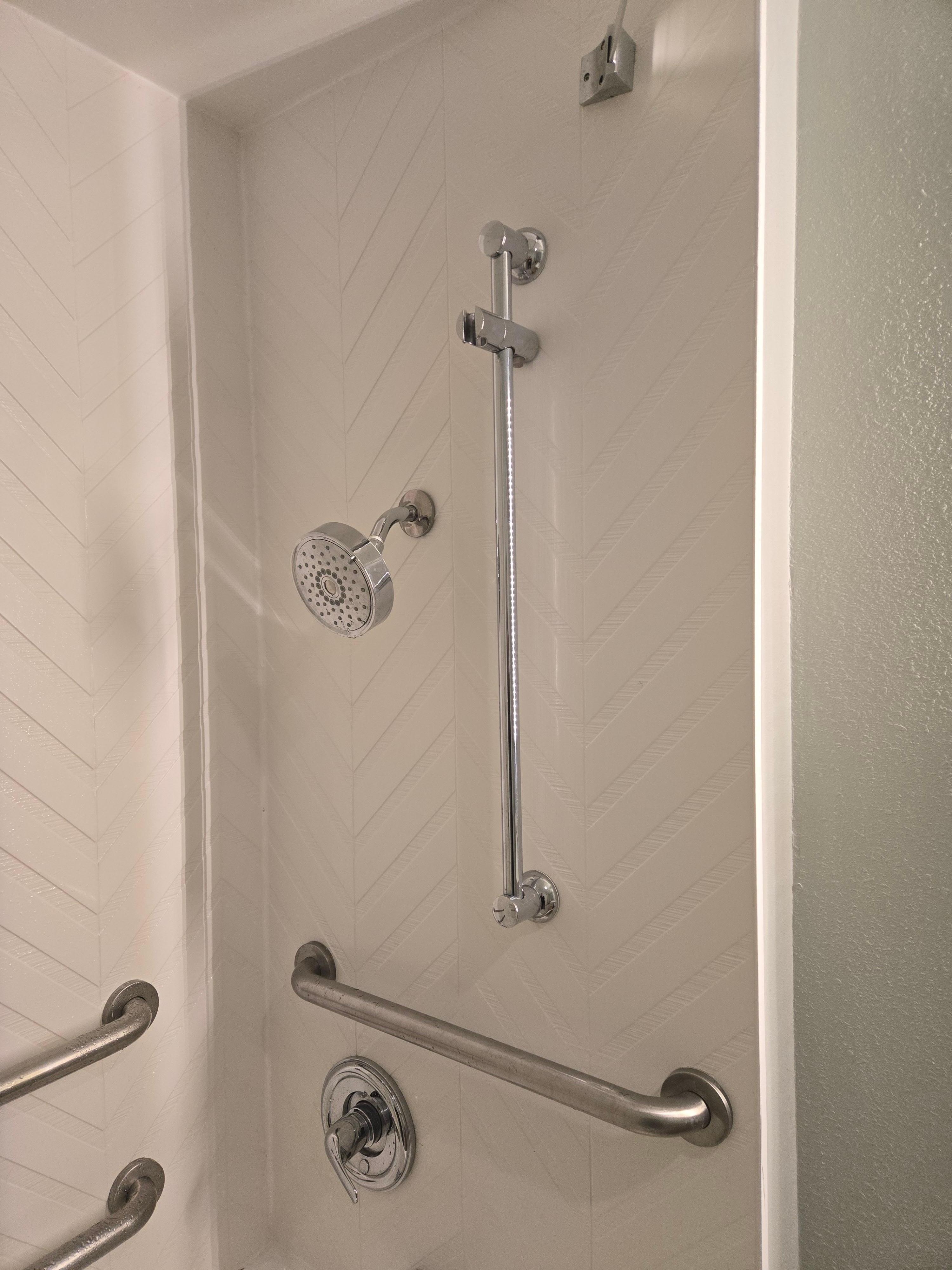 Showerhead height.There is a spot for a hand-held, but no hand-held available. 