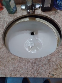 Vanity sink that had fallen thru the countertop.