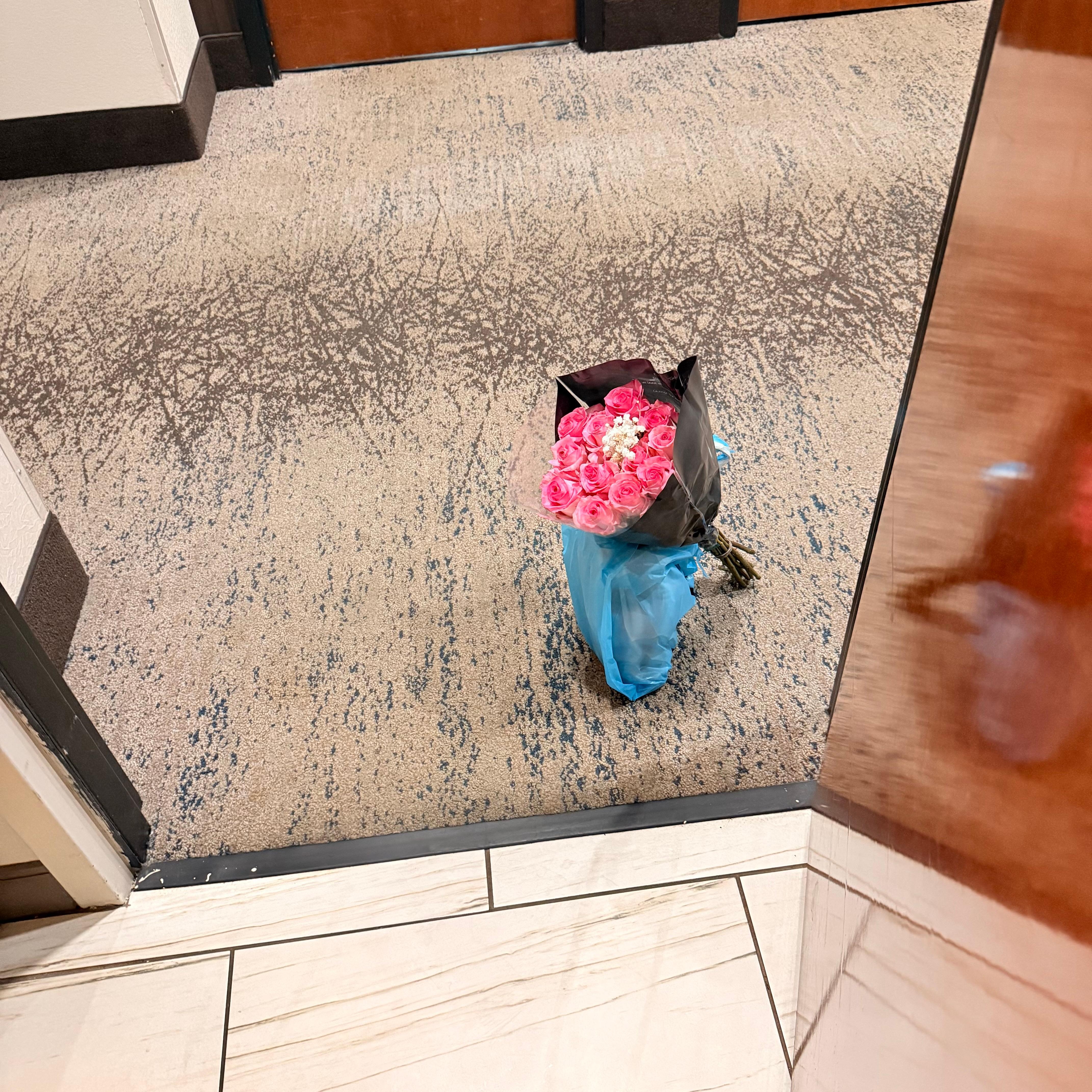 Recieving flowers at my hotel room door 