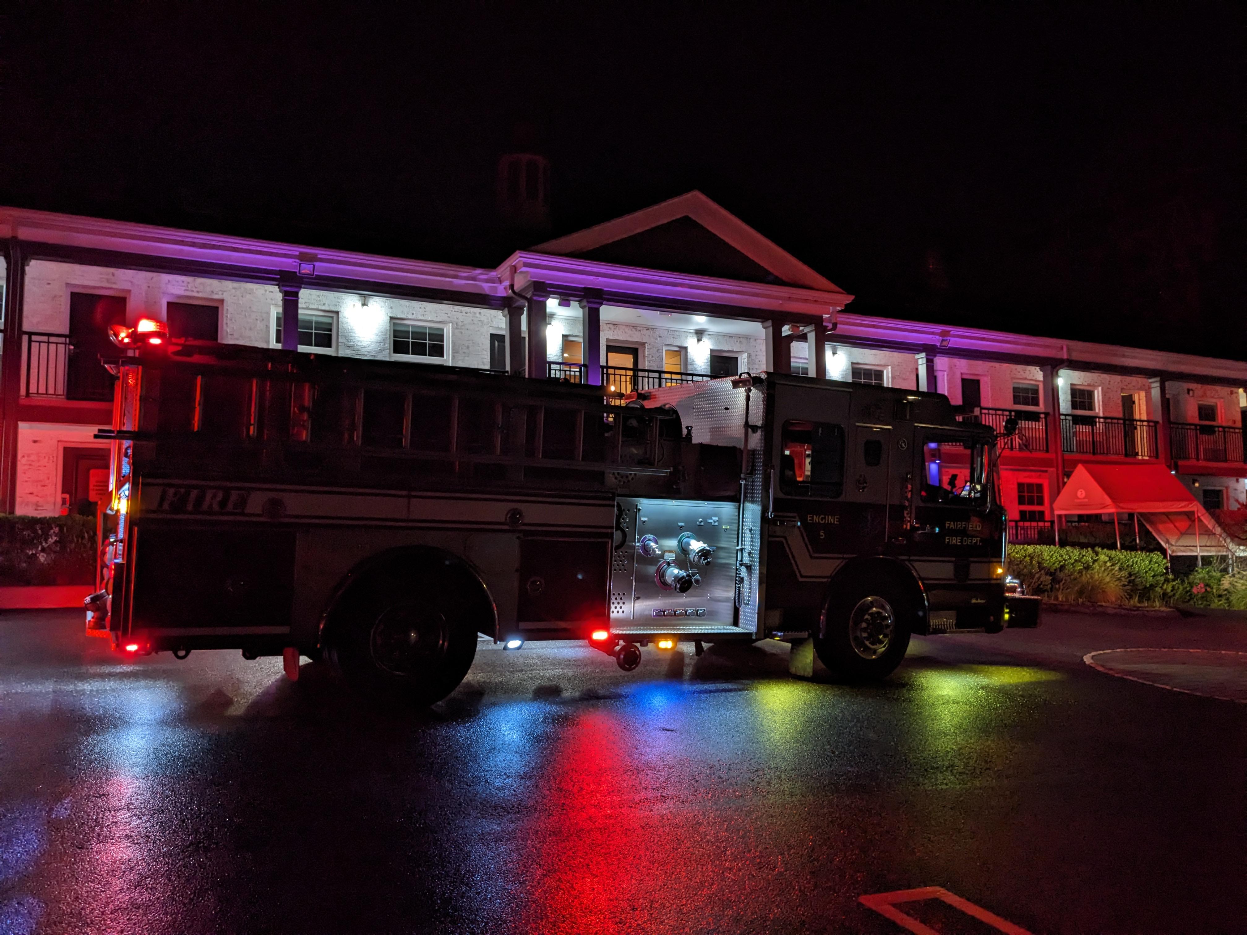 Fire truck outside our complex when someone triggered the fire alarm. People were still smoking near the building as this was happening.