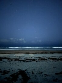 On the beach at night