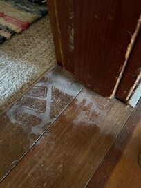 Hi written in floor dust